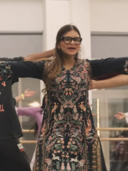 Students smiling and dancing together, completely lost in the music. This is what a fun Bollywood dance fitness class looks like.