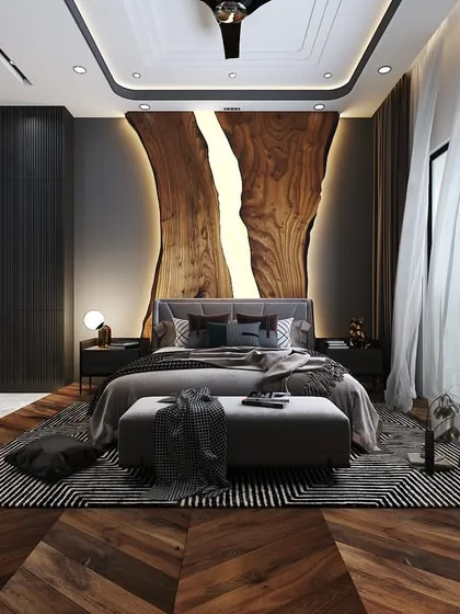 I designed this bedroom as a sanctuary, using a backlit, raw-edge wood feature to create a dramatic yet natural focal point. The combination of the dark wooden herringbone floor, plush textiles, and soft, ambient lighting results in a space that feels both cozy and exceptionally luxurious.