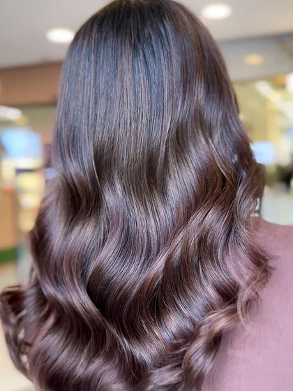A hot caramel brown hair color transformation. This shade is warm, rich, and full of life.
