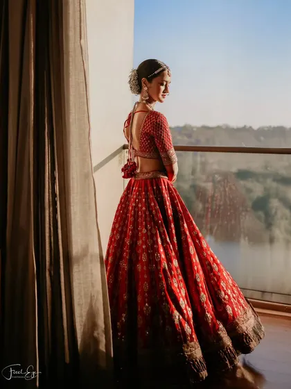 An elegant bridal portrait capturing a quiet moment of reflection before the ceremony. We focus on creating timeless, magazine-style portraits of our brides.
