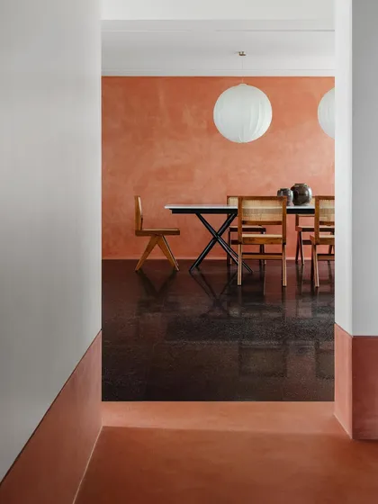 This dining space shows a table I designed with a slim profile and strong geometric base. It is paired with classic caned chairs, creating a look that is both modern and timeless.