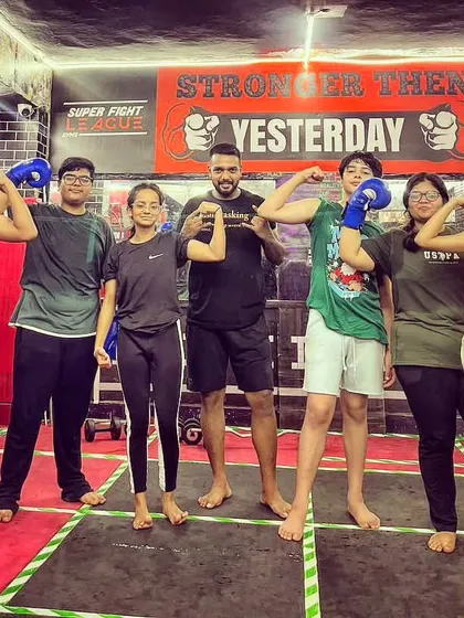 A group of my younger clients, boys and girls, showing off their strength. We are building the next generation of confident individuals.