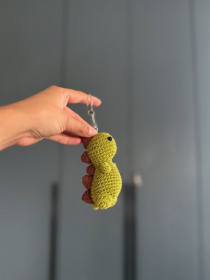 For all the dinosaur lovers, we have this cute little dino keychain. It's a perfect small gift.