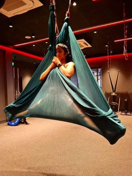 A moment of calm inside the aerial silk. Besides being a great workout, aerial yoga also provides a unique space for focus and relaxation.
