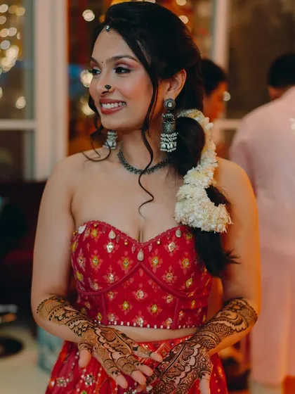 A mehendi function calls for a fun and vibrant look. I gave this bride-to-be a fresh, glowing base, defined eyes, and a joyful lip color that matched the festive energy of her red lehenga. The look was designed to be comfortable and long-lasting for the entire event.
