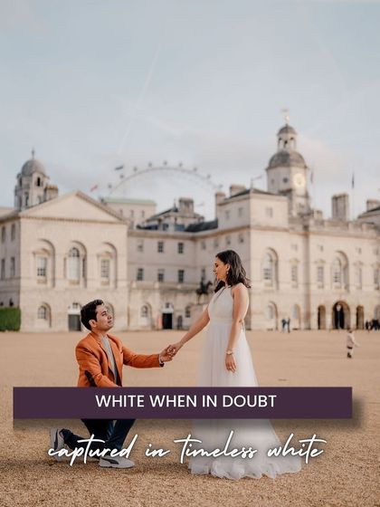 A classic proposal moment captured in London with a historic building and the London Eye in the background. The timeless white dress and the romantic gesture create a fairytale image in the heart of the city.