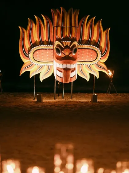 A close-up of the traditional Sri Lankan mask that served as a stunning centerpiece for a welcome dinner. Framed by torchlight and candles, it was a beautiful meeting of meaning and aesthetics.