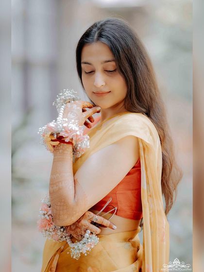 A personal photo from my wedding festivities, feeling content and happy. These personal moments of joy inspire the music I create.