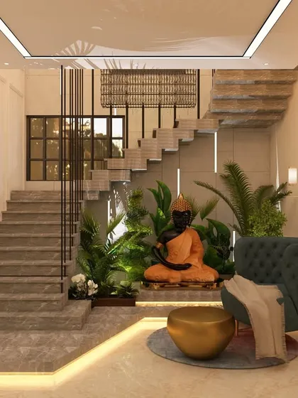 We created a serene and spiritual corner by integrating this staircase design with a tranquil seating area featuring a Buddha statue. The use of natural elements, subtle lighting, and open space under the stairs transforms a transitional area into a peaceful retreat within the home.