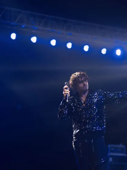 The artist and his stage. This shot of Sonu Nigam under a wide array of blue lights shows the scale of the production and his command over the entire stage.