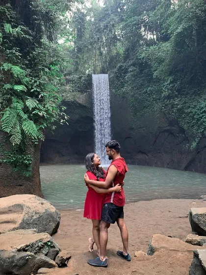 An intimate couple's moment at Tibumana Waterfall. Away from the epic views, these are the quiet, candid shots that truly capture the connection between two people on their journey together.