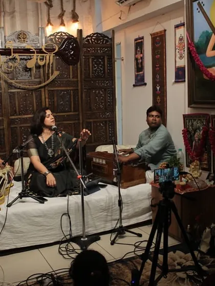 This is the atmosphere of our Swarveni Baithak, an intimate musical gathering. Here, we connect with the audience through music, featuring a full ensemble with me on vocals, accompanied by tabla and harmonium.