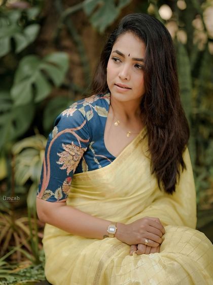 Another beautiful portrait. The contrast between the deep blue floral blouse and the soft yellow saree is just perfect, creating a look that is both traditional and modern.