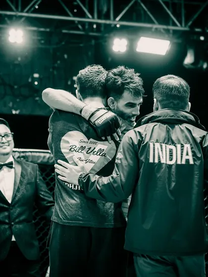 The embrace of a coach and teammate after a win. This moment is worth all the sacrifice and hard work.