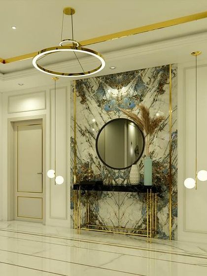 The lobby of "Yash Villa" features a stunning bookmatched marble wall as a backdrop for a sleek console table, creating a powerful first impression.