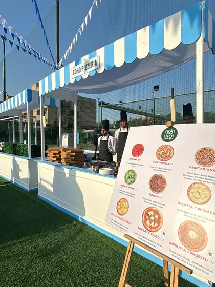 Here is one of my live pizza stations set up for an event at GD Goenka school. My setups are clean, professional, and can be customized to fit any space, whether it's an outdoor carnival or an indoor gathering.