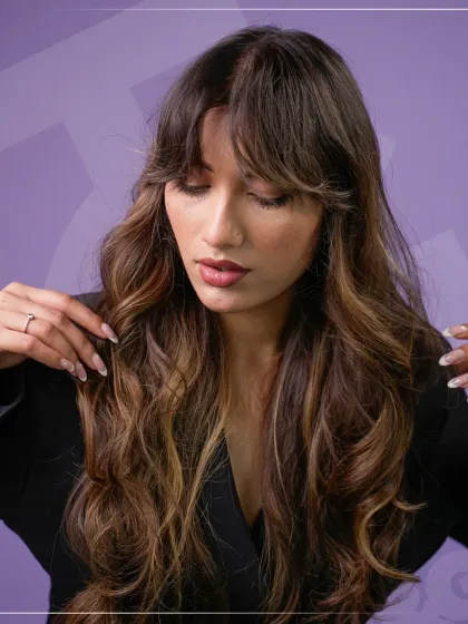 The final result of a masterclass demonstration. This model's soft, flowing waves and rich color, created by Bill Watson, exemplify the trend-setting, high-fashion looks our students learn to create.