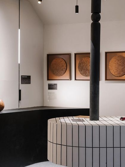 Another view of our exhibition space, where linear and spot lighting work together to create layers of light. The design was meticulously crafted to foster human engagement and leave a lasting impression.