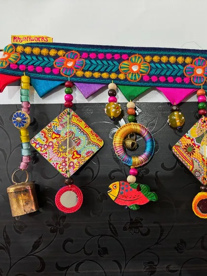 Another detailed shot of 'The Summer Song' toran, highlighting the combination of textures and bright, happy colors.