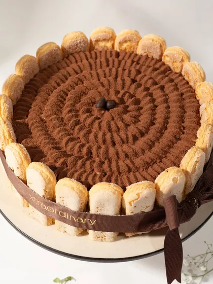 A closer look at the rich cocoa dusting and piped details on my Tiramisu cake. It's a little slice of Italy, made right here in my kitchen.