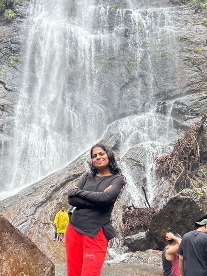 A trekker enjoying the view of a waterfall in Chikmagalur. Our trips offer plenty of moments for quiet reflection in nature.