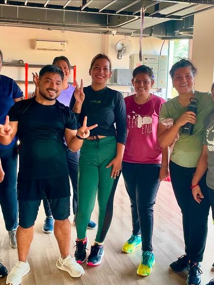 Peace signs and smiles all around. This picture perfectly captures the positive and supportive atmosphere of our Zumba classes.