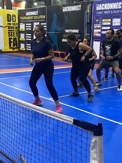 Players participating in a warm-up drill during a pickleball clinic. Proper warm-ups are key to preventing injuries and getting ready for the quick, dynamic movements of the game.