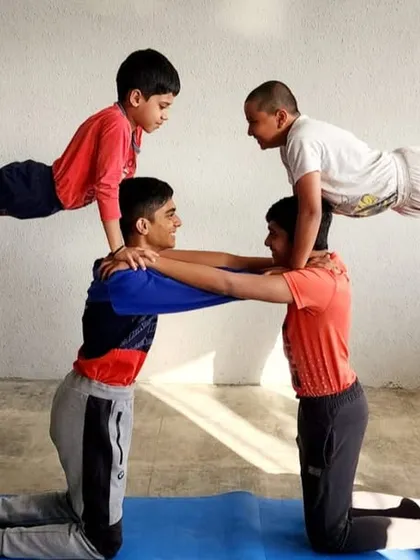 Strength and teamwork are built both in and out of the water. Our unique dry-land training includes acro yoga sessions that improve balance, core strength, and trust among our swimmers.