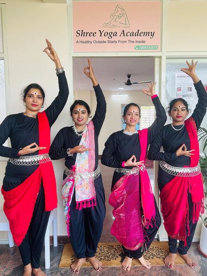 The four performers striking a final, graceful pose. Their dedication to their art and practice is commendable.