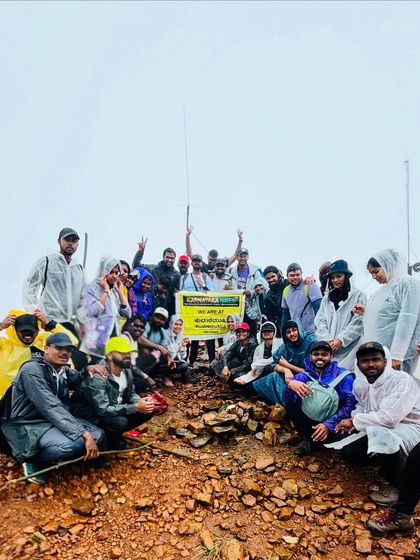 Another happy group at the Kudremukha peak, holding our banner high after a challenging but rewarding trek.