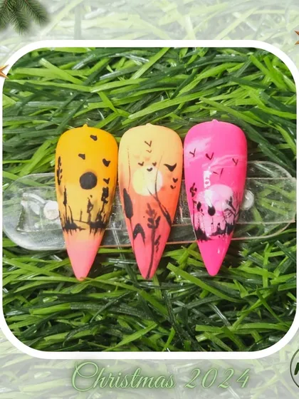 A beautiful sunset-themed nail art set created by a student, showcasing their skill in color blending and silhouette painting.