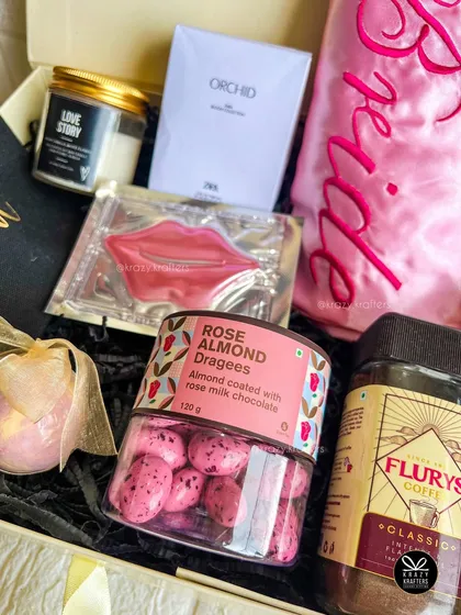 This angle highlights the delicious rose almond dragees and other curated items that make this bridal hamper a treat for all the senses.