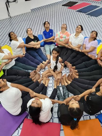 The 'human lotus' we created on Yoga Day. This represents our community blooming and growing together through the practice of yoga.