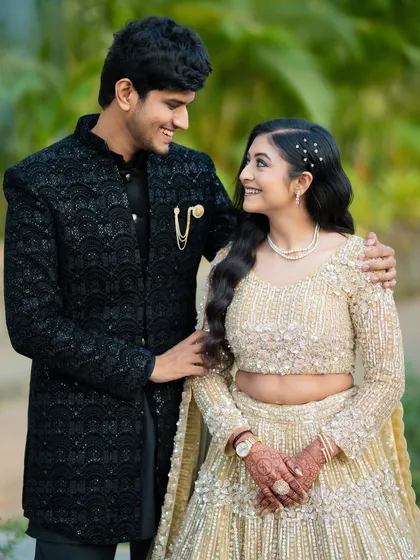 A lovely portrait of Apoorv and Shikha, showcasing their elegant engagement attire and the natural, happy connection between them.