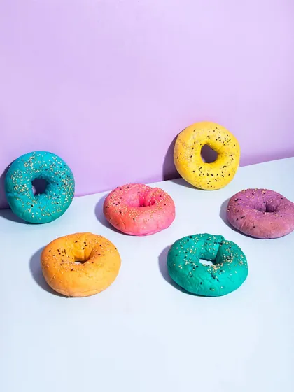 An assortment of my vibrant Holi bagels, ready to be toasted and served with your favorite cream cheese.