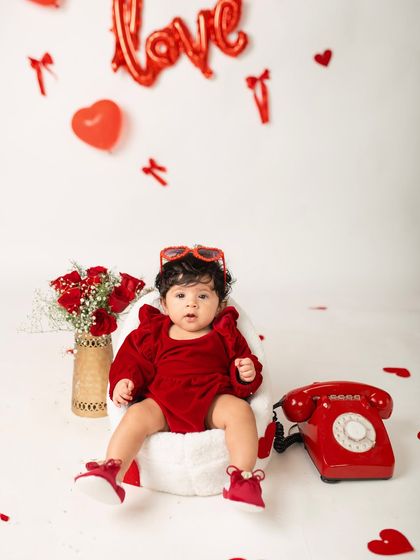A little Valentine's Day diva. At four months, babies can often sit with support, making it a great time for fun, themed photos like this one.