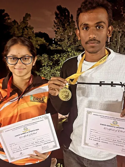 Celebrating school-level success. Bhojaraj and Yuvaanika show off their gold and silver medals from the CISCE School Games, representing their schools with pride after training at our academy.