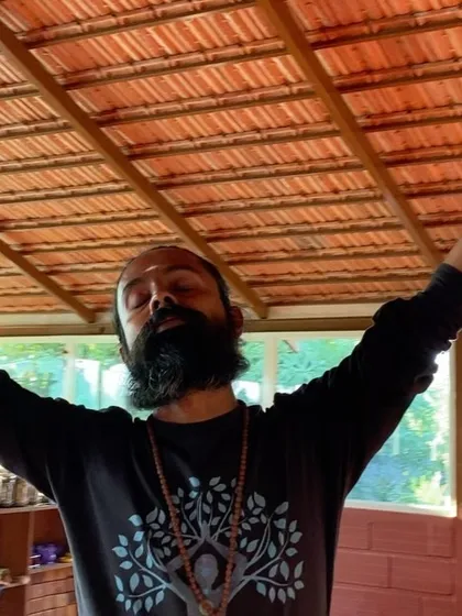 I surrender to the moment with arms outstretched. This is a practice of opening up to receive grace and energy, a feeling we cultivate in our daily sessions.