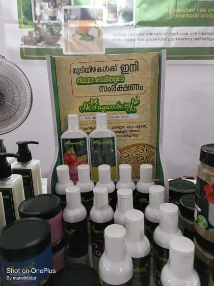 A close-up of the products displayed at our stall. My banner says "For hair, now the protection of Neelayambary," which is my promise to you.