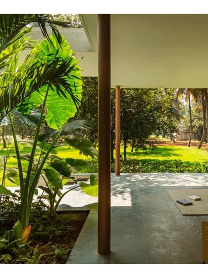 A covered verandah blurs the boundary between inside and out. This "in-between" space allows the residents to enjoy the garden and fresh air while being protected from the elements.