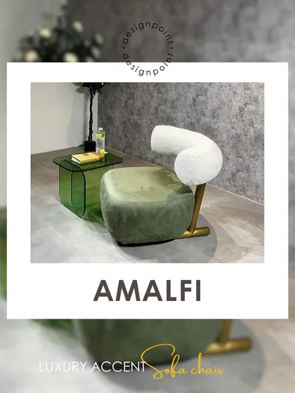 The 'Amalfi' luxury accent chair combines a unique, sculptural form with rich materials. The green velvet seat and curved bouclé backrest create a stunning visual contrast.