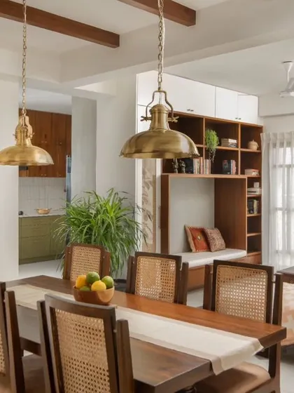 For the Reddy Home, we designed a dining area that blends neo-traditional elements with modern comfort. The custom teak dining set, antique brass lighting, and a reclaimed wooden column create a warm, inviting space for family gatherings.