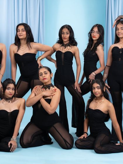 Our teen jazz dancers strike a pose. This photo captures the style and confidence they bring to their performances.