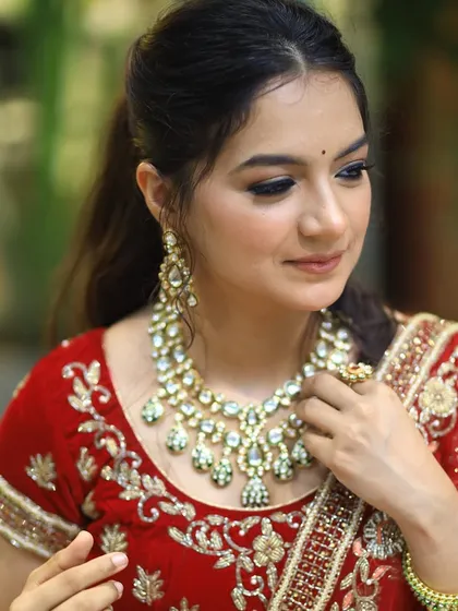 A soft glam look for this ethereal Indian bride, featuring a high ponytail and beautifully defined eyes.
