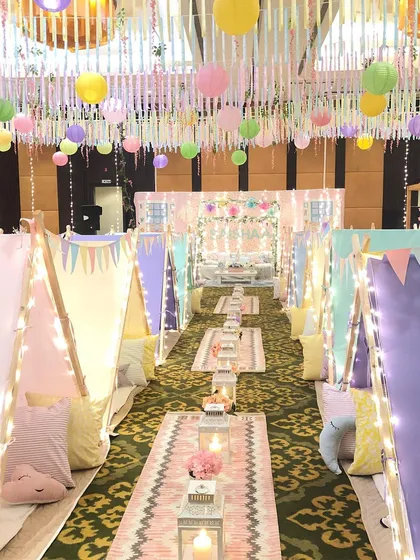 A slumber party, but make it magical. I designed this dreamy setup with individual teepees, fairy lights, and plush cushions to create a cozy and unforgettable birthday experience under a blanket of dreams.