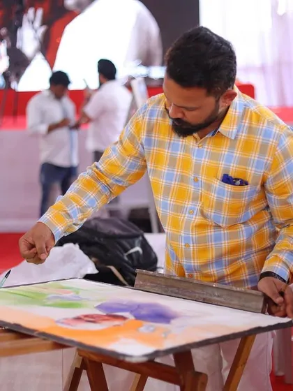 Preparing the paper with initial washes of colour, setting the tricolour theme for the background.