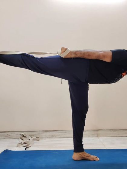 Using a strap in Baddha Virabhadrasana III demonstrates the principle of 'Sthira Sukham Asanam'. Props are not a crutch; they are intelligent tools to make poses accessible and help you find stability and comfort.