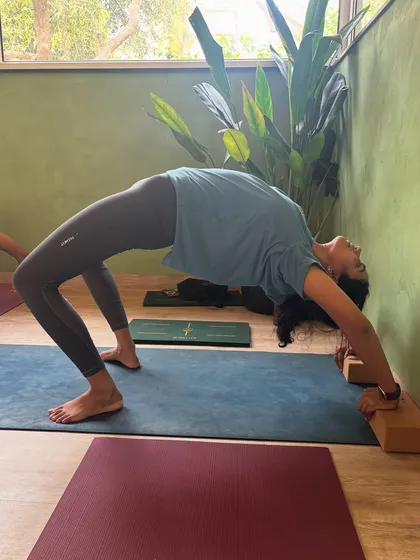 A perfect wheel pose, showcasing the strength and openness that comes from a dedicated yoga practice. This is the same image as the testimonial, used here to focus on flexibility.