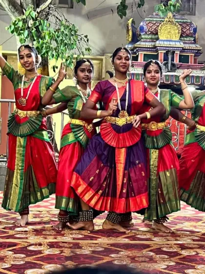 A group of my students in a dynamic pose during their performance at the Karaga Utsava.