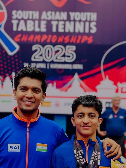 A proud coach moment with Atharva at the South Asian Championship. The bond between coach and player is crucial to success.